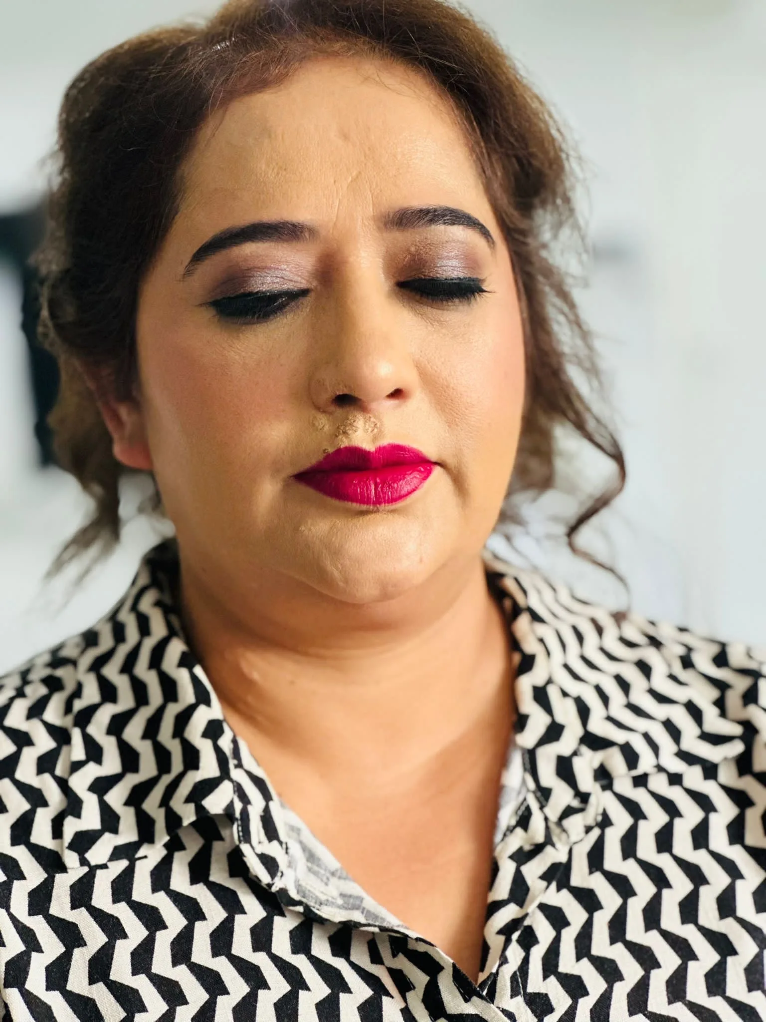 Close-up glam makeup with a bold red lip